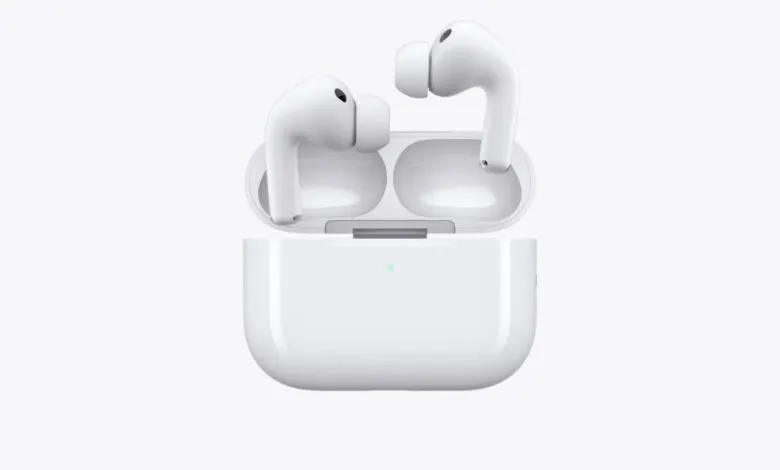 White Apple AirPods Pro with charging case, one earbud in case, one in air.