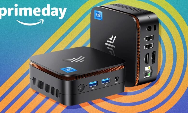 Two black Intel NUC mini PCs with orange accents against a blue and yellow abstract background.