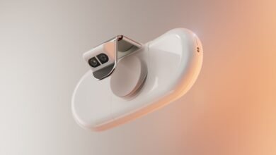 Close-up of a sleek, white medical device with a camera and lens.