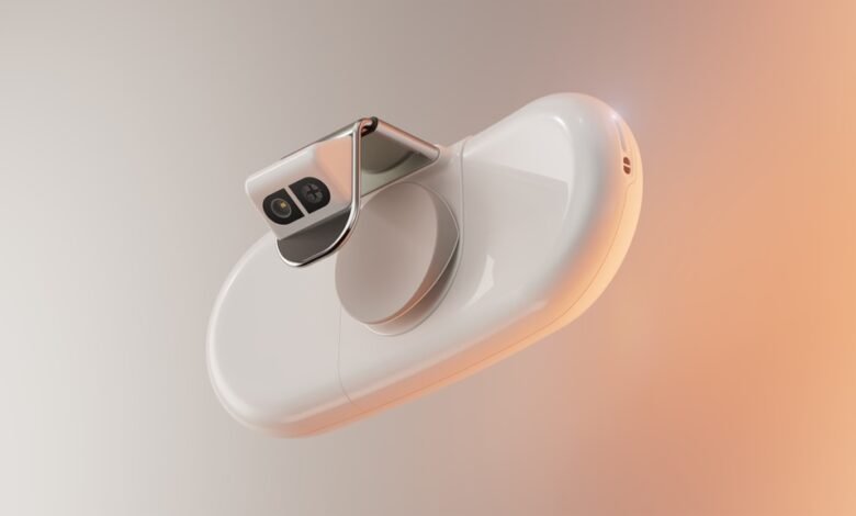 Close-up of a sleek, white medical device with a camera and lens.