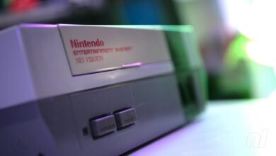 Close-up of a Nintendo Entertainment System (NES) console with power and reset buttons.