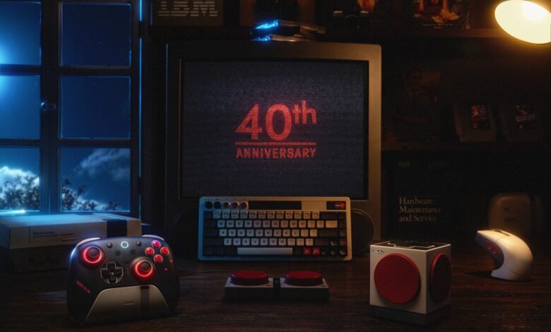 Retro gaming setup with vintage computer, controller, and Nintendo console.