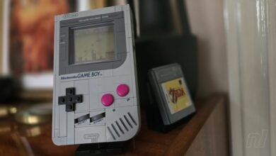 A LEGO replica of a Nintendo Game Boy with a Legend of Zelda cartridge.