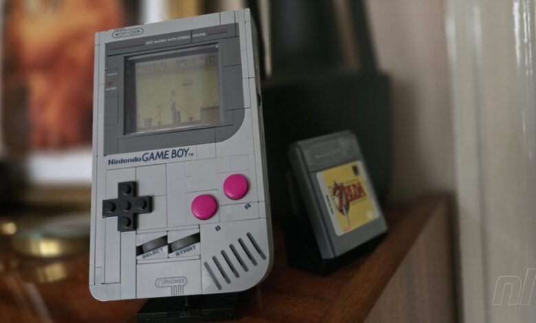 A LEGO replica of a Nintendo Game Boy with a Legend of Zelda cartridge.