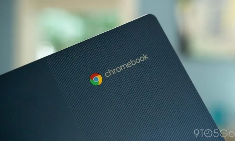 Close-up of a dark blue Chromebook lid with the Google Chrome logo and 'Chromebook' text.