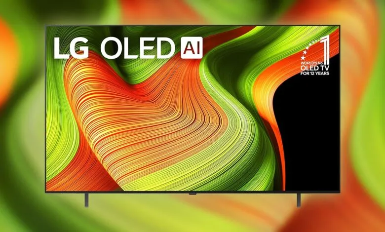 LG OLED AI TV displaying a vibrant, abstract wave pattern in red, orange, and green.