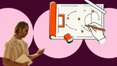 Man with phone and laptop next to marketing strategy diagram