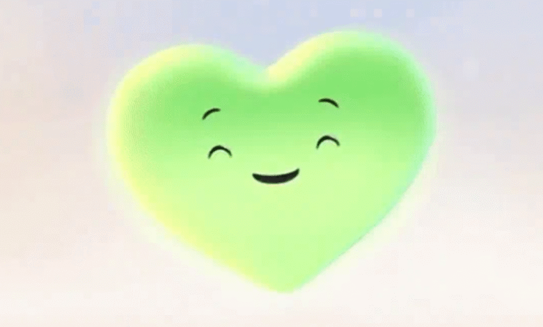 A glowing, smiling green heart character with closed eyes and a happy expression.