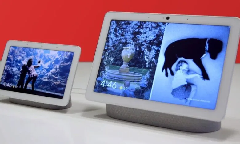 Two Google Nest Hub smart displays showing different photos and the time.