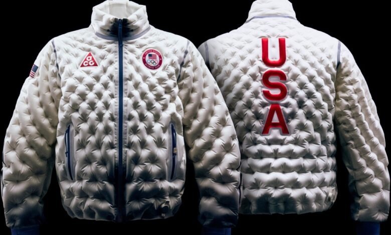 Front and back view of a white Nike ACG puffer jacket with USA lettering.