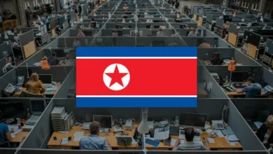 North Korean flag superimposed over a busy office cubicle environment with many workers.