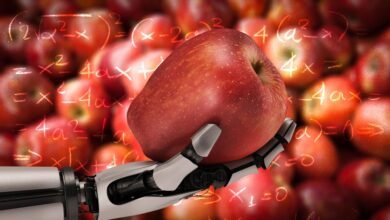 A robotic hand holds a red apple with mathematical equations superimposed on a background of apples.