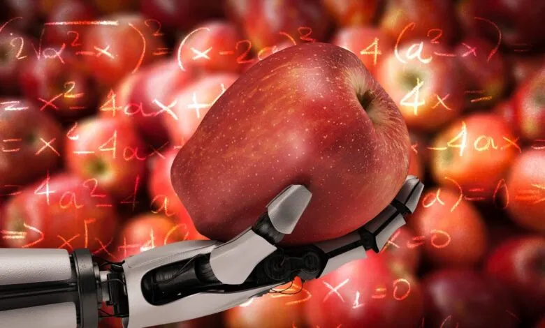 A robotic hand holds a red apple with mathematical equations superimposed on a background of apples.
