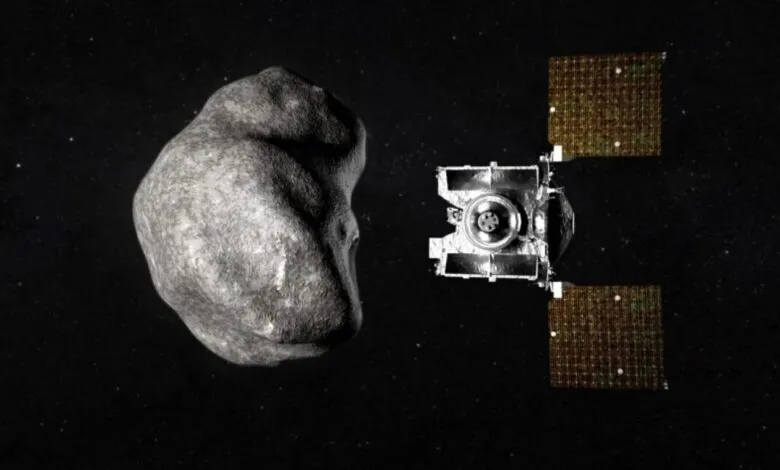 A spacecraft approaches a large, irregularly shaped asteroid in the blackness of space.