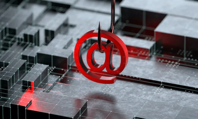 Red '@' symbol impaled on a fishing hook, symbolizing cyber threats.