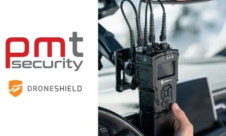 Close-up of a DroneShield communication device mounted in a vehicle, with PMT Security logo.