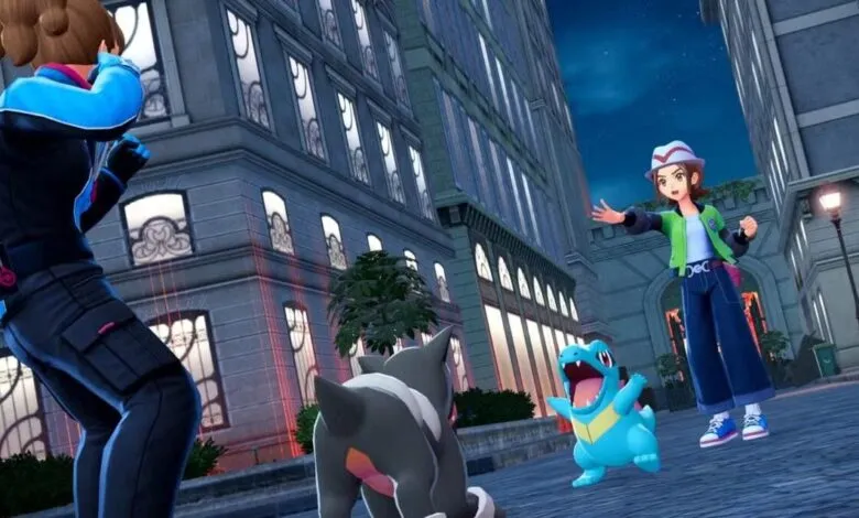 A trainer in a blue jacket and a girl in a green jacket interact with Pokemon in a city at dusk.