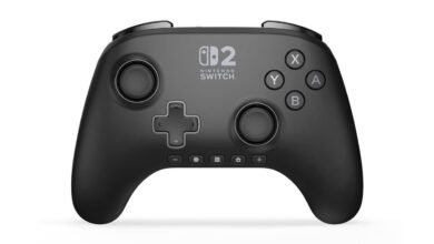 Black wireless Nintendo Switch controller with directional pad and buttons