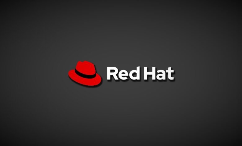 Red Hat logo with a red fedora hat and the text 'Red Hat' on a dark gray background.