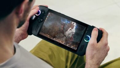 Person playing a video game on a handheld ROG Ally console.