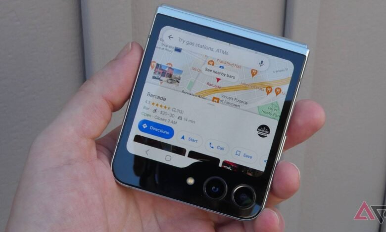 Close-up of a person holding a Samsung Flip 5 phone displaying Google Maps.