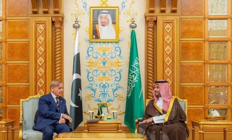 Pakistani Prime Minister Shehbaz Sharif meets with Saudi Crown Prince Mohammed bin Salman in a formal setting.