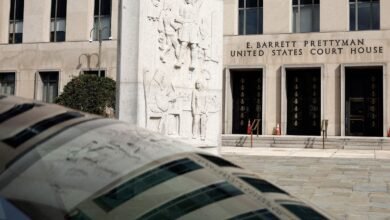 E. Barrett Prettyman United States Court House entrance with relief sculpture and foreground element.