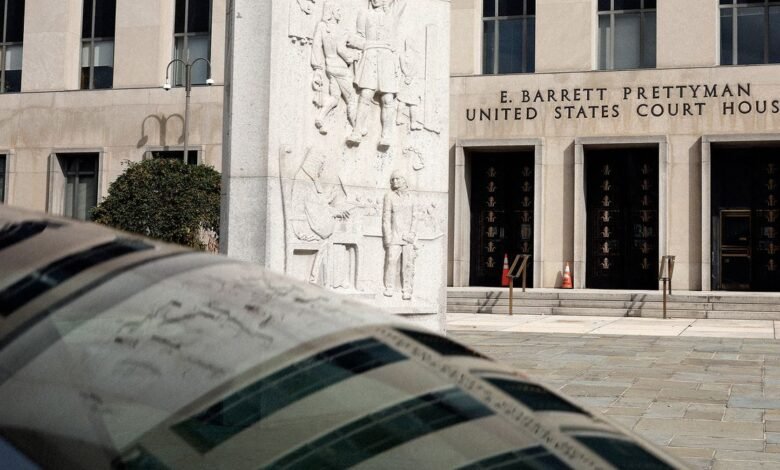 E. Barrett Prettyman United States Court House entrance with relief sculpture and foreground element.