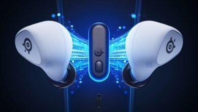 Pair of white SteelSeries gaming earbuds with a charging case against a blue, glowing background.