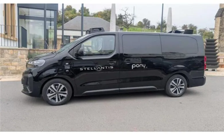 Black Stellantis van with Pony.ai branding parked outdoors.