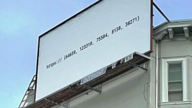 Billboard displaying a URL with numbers and a ladder leaning against it.