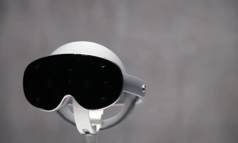 Close-up of a white virtual reality headset with a black visor.