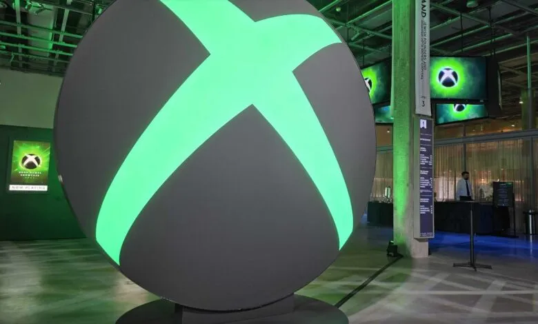 Large, illuminated Xbox logo sphere at a gaming event.