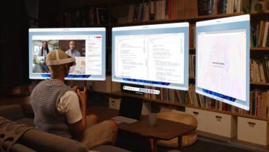 Person wearing VR headset interacting with multiple floating Windows 11 screens in a home office.