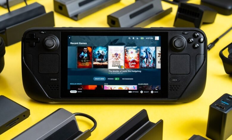 Steam Deck handheld console displaying game library on a bright yellow surface.
