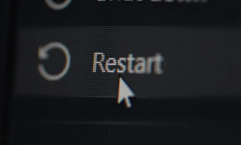 Close-up of a computer screen showing the 'Restart' option highlighted by a cursor.