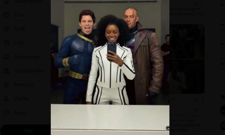 Actors in X-Men costumes pose for a selfie, smiling at the camera.