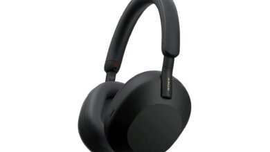 Black Sony WH-1000XM5 wireless noise-canceling headphones on white background.