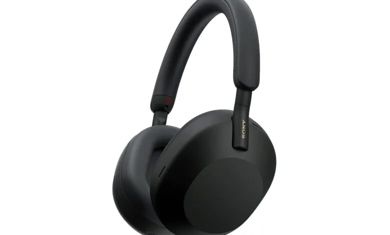 Black Sony WH-1000XM5 wireless noise-canceling headphones on white background.