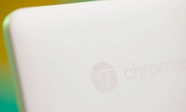 Close-up of a white HP Chromebook with the Chrome logo embossed.