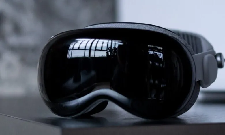 Close-up of a sleek, black virtual reality headset with a reflective visor.
