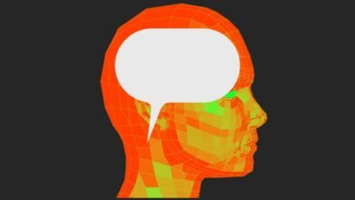 Orange wireframe head profile with a white speech bubble.