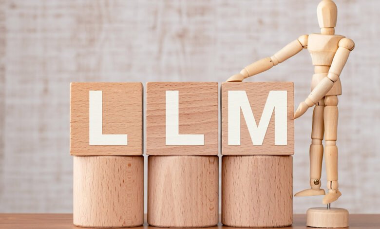 Wooden blocks spelling LLM with a mannequin figure adjusting the 'M' block.
