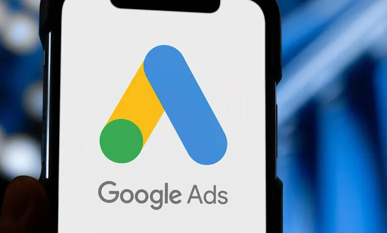 Close-up of a smartphone displaying the Google Ads logo and text.