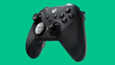 Close-up of a black Xbox Elite Series 2 controller against a vibrant teal background.