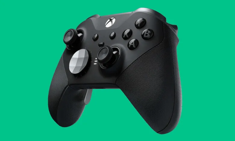 Close-up of a black Xbox Elite Series 2 controller against a vibrant teal background.