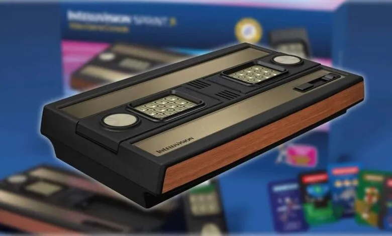 Close-up of a vintage Intellivision video game console with wood grain accents.