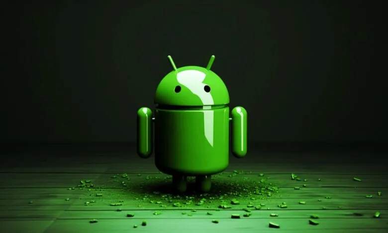 The iconic green Android robot mascot stands on a wooden surface with scattered debris.