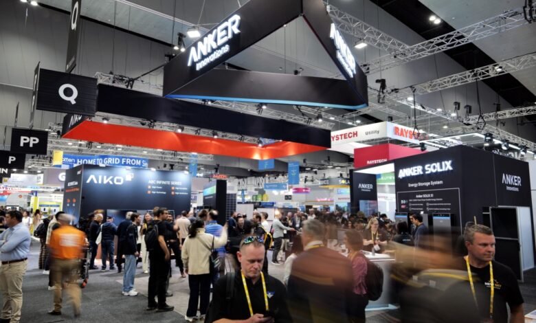 Crowded trade show floor with Anker Innovations booth prominently displayed