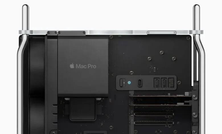 Close-up view of the internal components of an Apple Mac Pro, showing ports and circuitry.